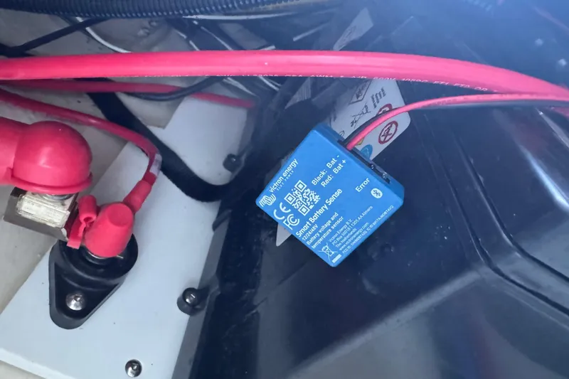 Slide: The Image of 2025 Ranger Tugs R-27 battery setup with Victron Energy Smart Battery Sense device. - 27