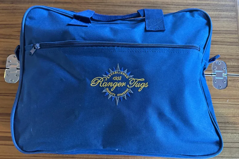 Slide: The Image of Blue Ranger Tugs bag with logo, showcasing 2025 R-27 model branding. - 32