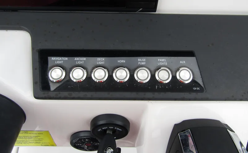 Slide: The Image of Control panel of 2022 Axopar 22 T-Top boat with labeled switches. - 15