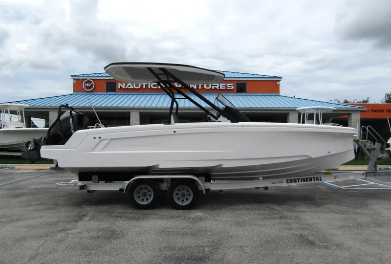 Slide: The Image of 2022 Axopar 22 T-Top boat on trailer at Nautical Ventures dealership. - 3