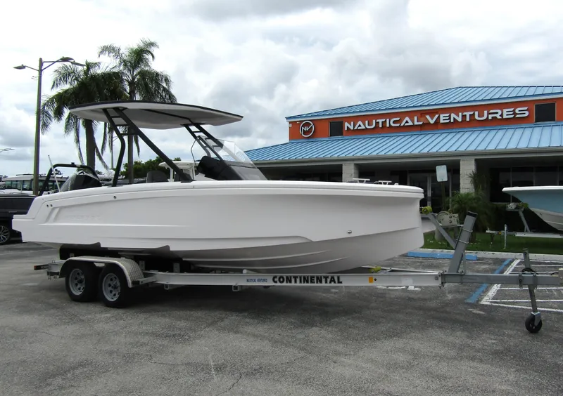 Slide: The Image of 2022 Axopar 22 T-Top boat on trailer at Nautical Ventures dealership. - 4