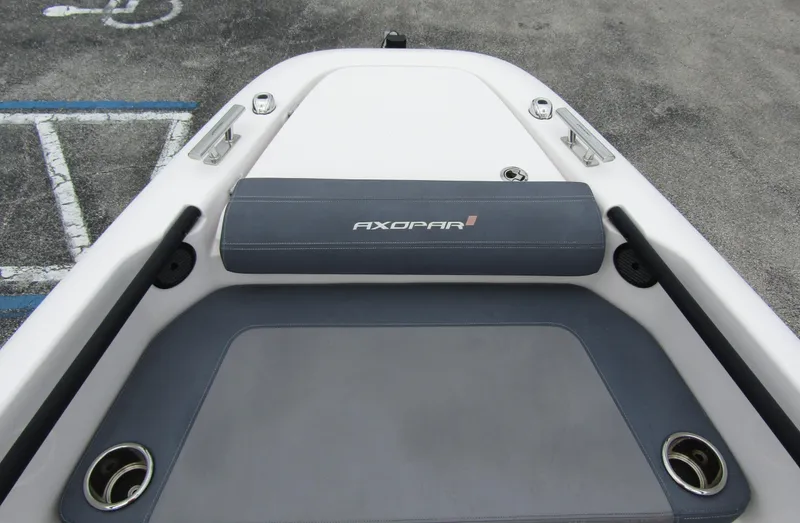 Slide: The Image of 2022 Axopar 22 T-Top boat deck with seating and cup holders. - 6