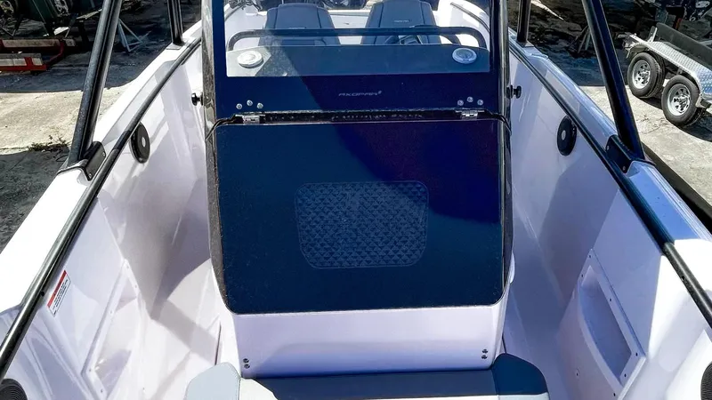Slide: The Image of 2023 Axopar 22 T-Top boat interior with sleek design and modern features. - 9
