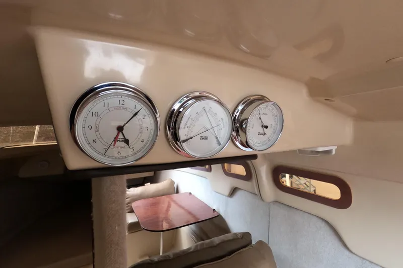 Slide: The Image of Interior of 2007 MacGregor 26M sailboat with gauges and cozy seating area. - 14