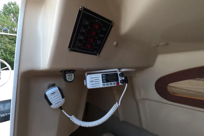 Slide: The Image of Interior of a 2007 MacGregor 26M sailboat with radio and control panel. - 21