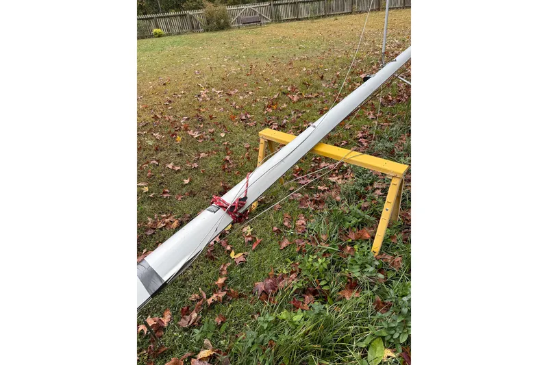 Slide: The Image of Mast of 2007 MacGregor 26M sailboat on grass with autumn leaves. - 28