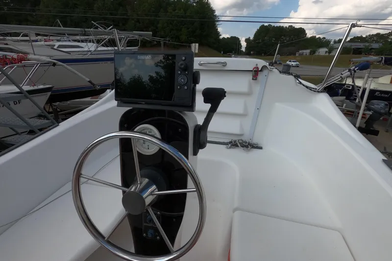 Slide: The Image of Steering wheel and navigation system on a 2007 MacGregor 26M sailboat. - 8