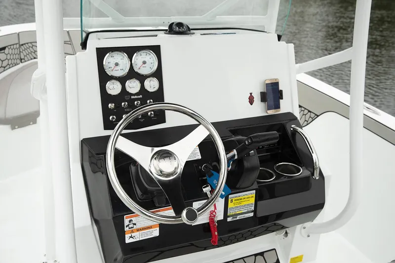 Slide: The Image of Manufacturer Provided Image: 2021 Wellcraft 202 Fisherman boat dashboard with steering wheel and instrument panel. - 10