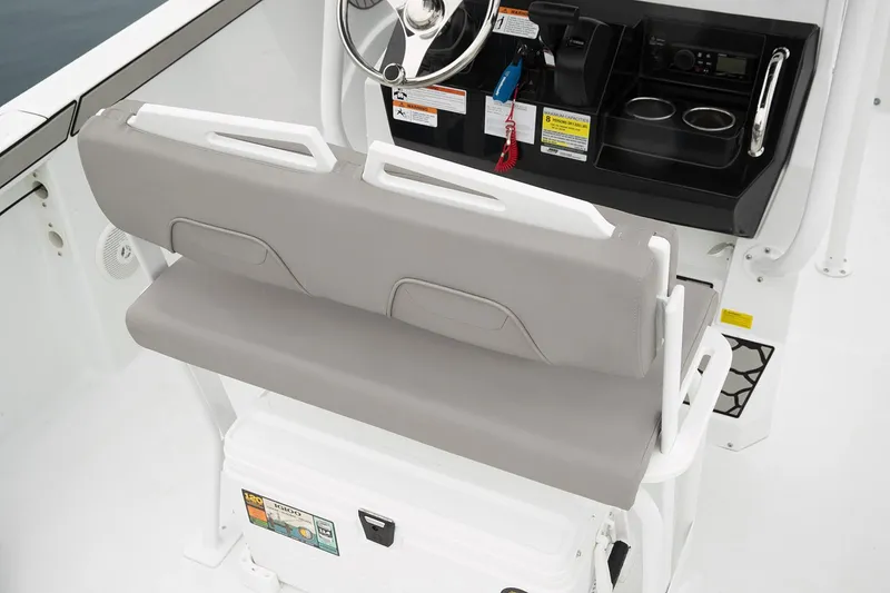 Slide: The Image of Manufacturer Provided Image: Wellcraft 202 Fisherman 2021 boat interior with steering console and cushioned seating. - 11