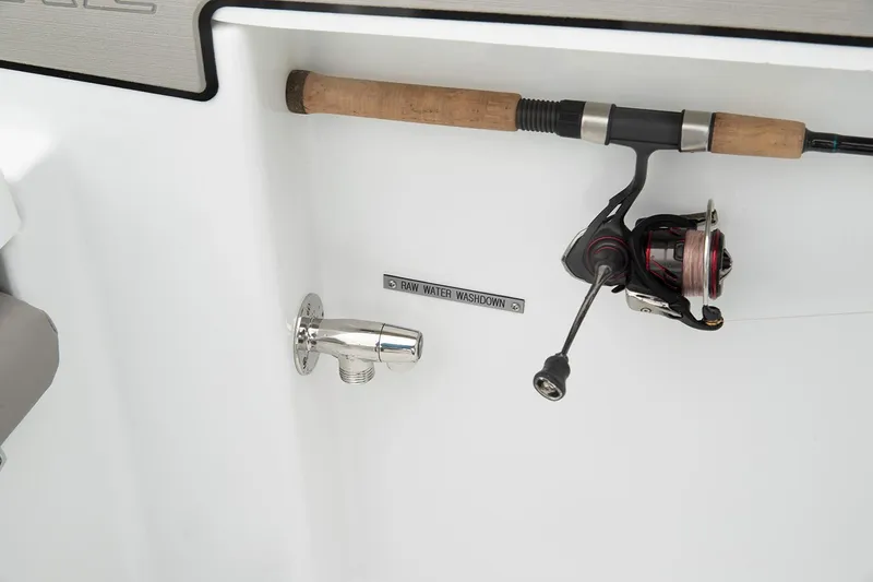 Slide: The Image of Manufacturer Provided Image: Fishing rod holder and raw water washdown on 2021 Wellcraft 202 Fisherman boat. - 15