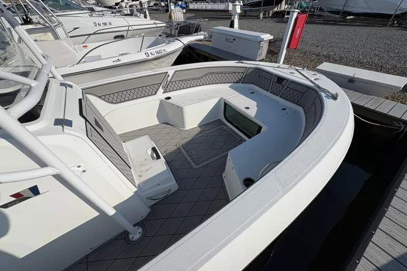 Slide: The Image of 2021 Wellcraft 202 Fisherman boat interior with spacious seating and storage. - 3