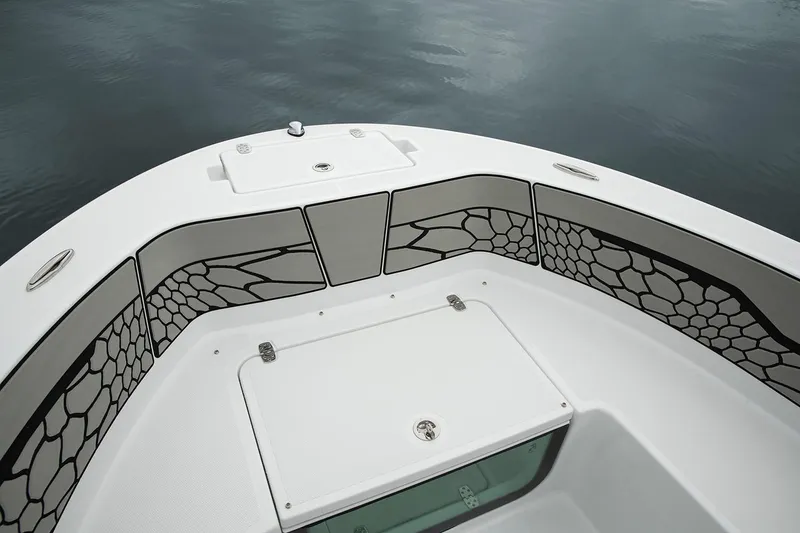 Slide: The Image of Manufacturer Provided Image: 2021 Wellcraft 202 Fisherman boat bow with storage compartments and stylish padding. - 7