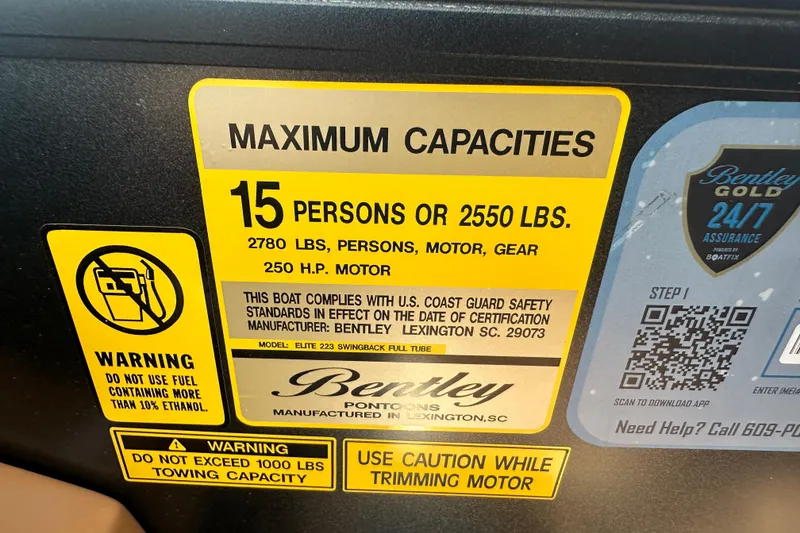 Slide: The Image of 2025 Bentley Pontoons 223 Elite Swingback capacity label, 15 persons or 2550 lbs, safety warnings. - 15