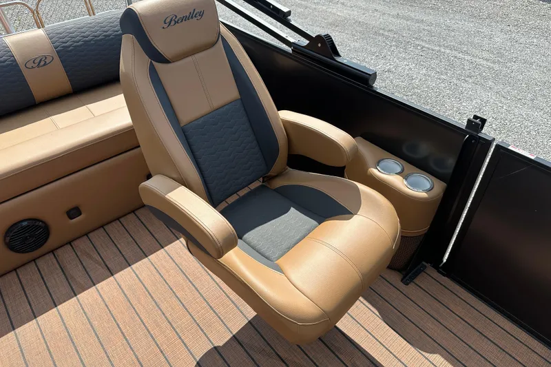 Slide: The Image of 2025 Bentley Pontoons 223 Elite Swingback interior with luxurious seating and cup holders. - 16