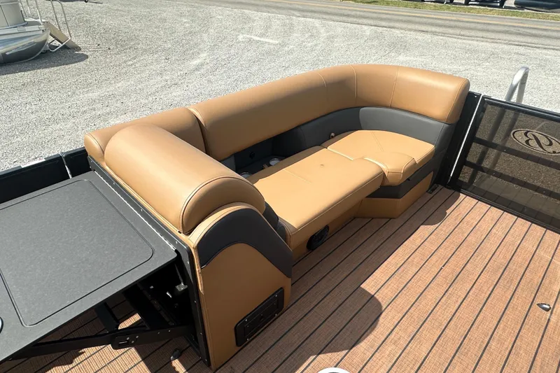 Slide: The Image of 2025 Bentley Pontoons 223 Elite Swingback with tan seating and sleek deck design. - 2