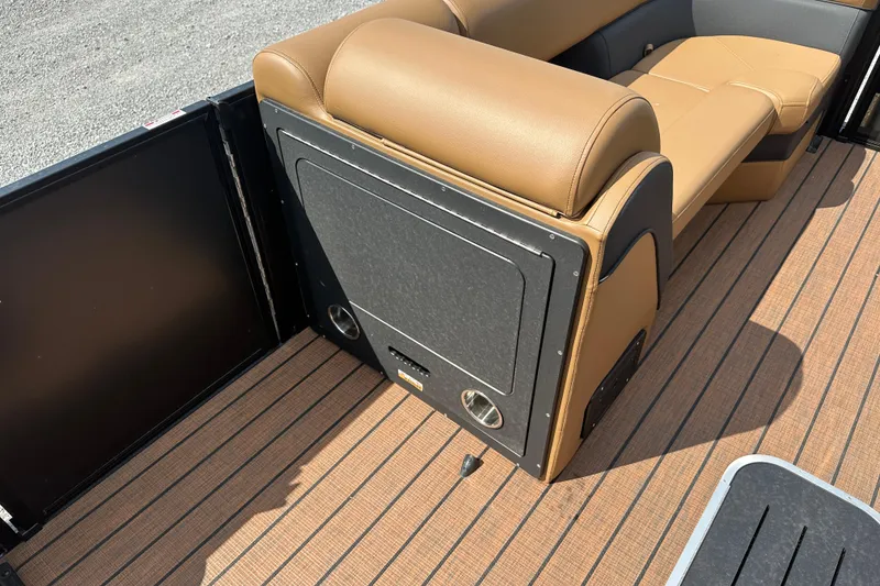 Slide: The Image of 2025 Bentley Pontoons 223 Elite Swingback interior with tan seating and wood-style flooring. - 20