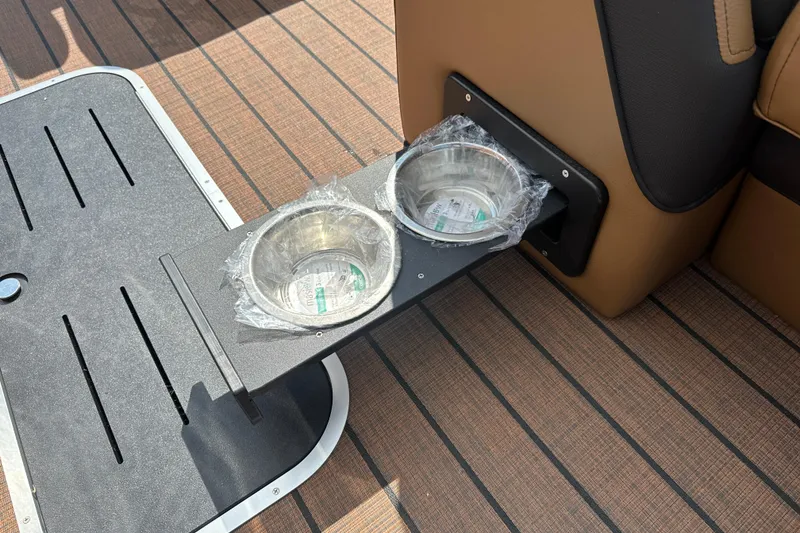 Slide: The Image of 2025 Bentley Pontoons 223 Elite Swingback with built-in cup holders on deck. - 25