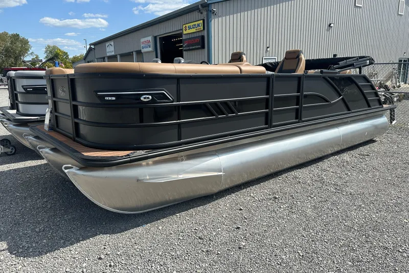 Slide: The Image of 2025 Bentley Pontoons 223 Elite Swingback, sleek black design, parked outdoors. - 3