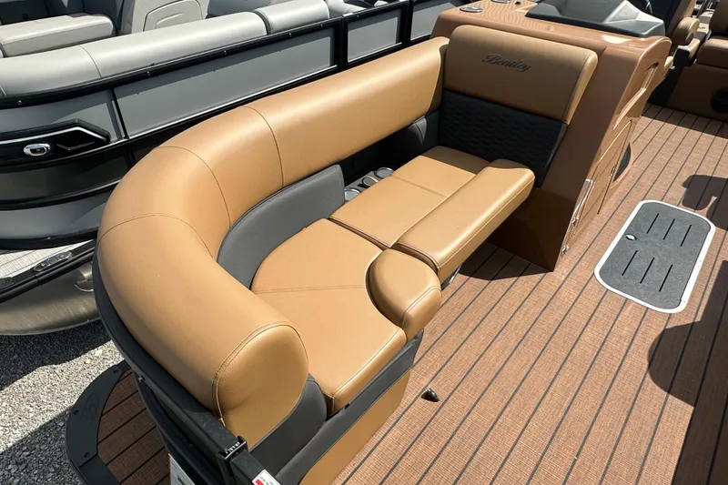 Slide: The Image of 2025 Bentley Pontoons 223 Elite Swingback with luxurious tan seating and sleek design. - 4