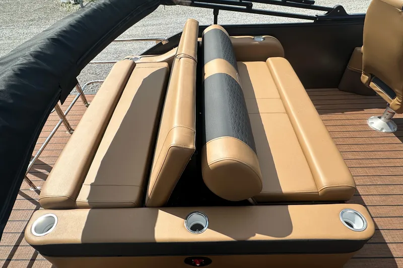 Slide: The Image of 2025 Bentley Pontoons 223 Elite Swingback with tan leather seating and cup holders. - 6