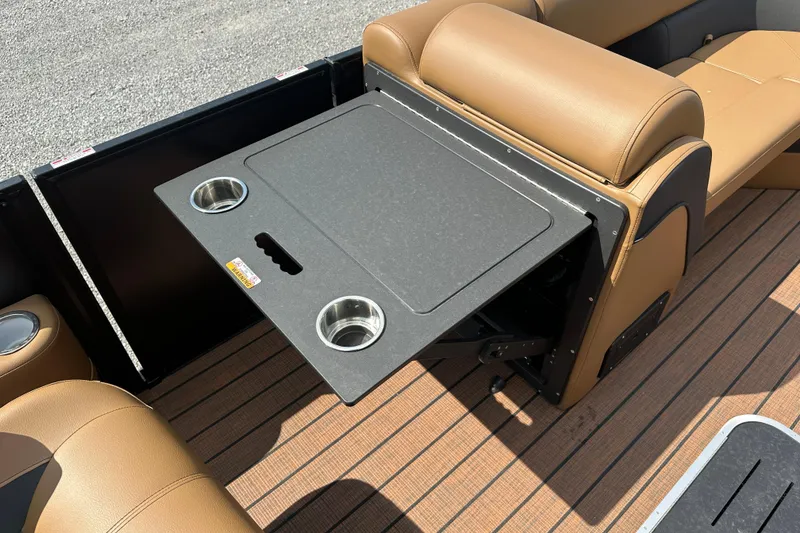 Slide: The Image of 2025 Bentley Pontoons 223 Elite Swingback with foldable table and cup holders on deck. - 9