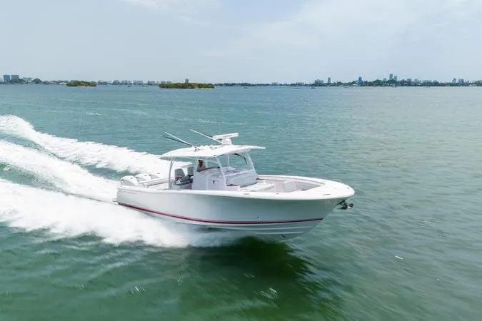 The Image of 2025 Southport 38 FE boat cruising on open water, showcasing sleek design and performance. - 0
