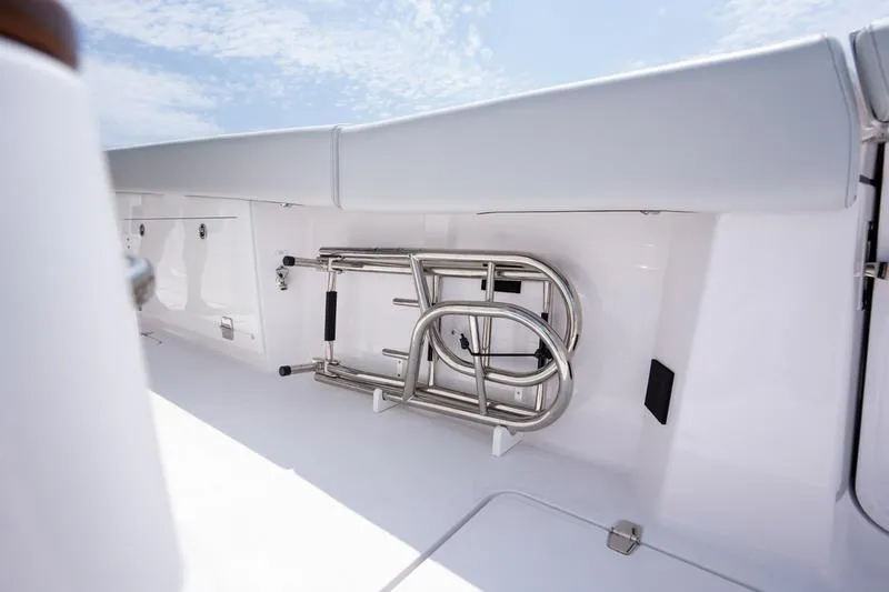 Slide: The Image of 2025 Southport 38 FE boat with stainless steel ladder stored on deck. - 13