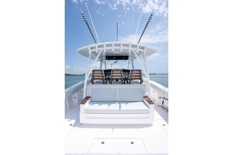 Slide: The Image of 2025 Southport 38 FE boat with seating, ocean view, and clear sky. - 16