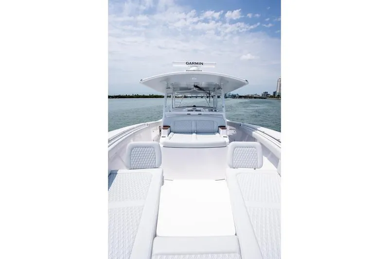 Slide: The Image of 2025 Southport 38 FE boat interior with white seating, open water view. - 18