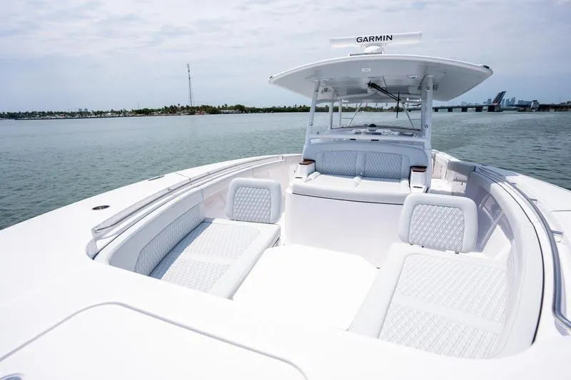 Slide: The Image of 2025 Southport 38 FE boat with spacious seating on calm waters. - 20