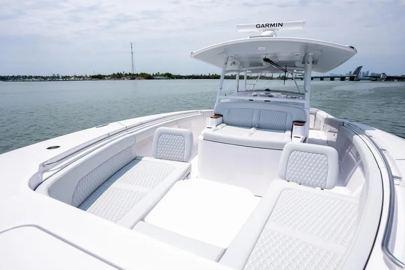 Slide: The Image of 2025 Southport 38 FE boat with spacious seating on calm waters. - 21