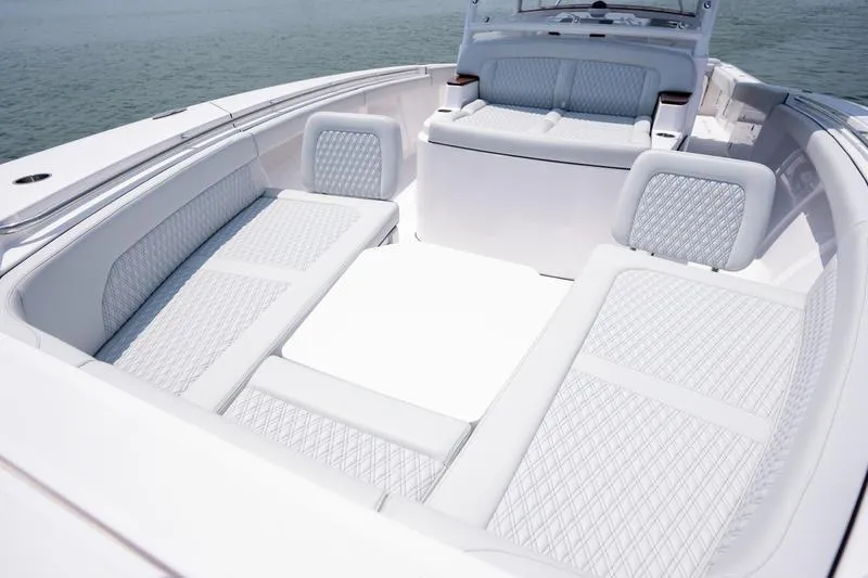 Slide: The Image of Luxurious seating area on 2025 Southport 38 FE boat, featuring elegant white upholstery. - 22