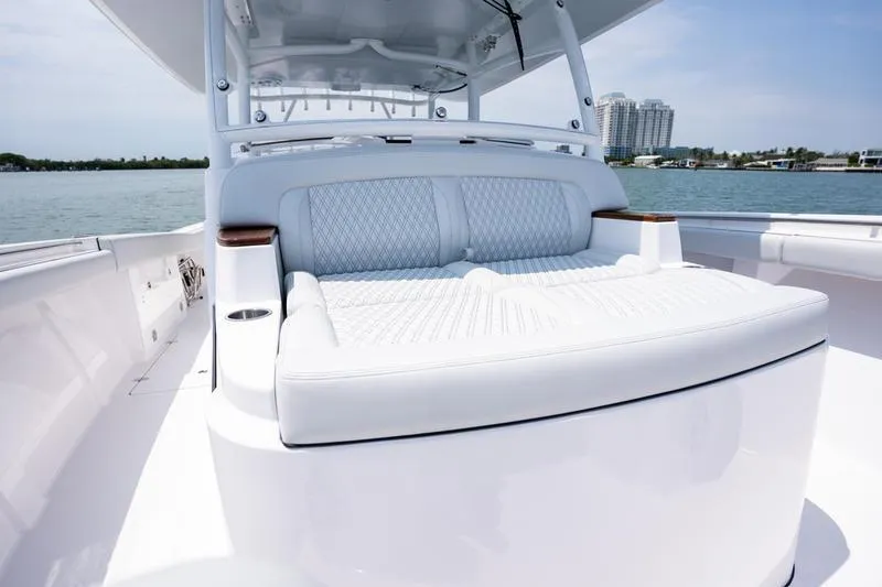 Slide: The Image of 2025 Southport 38 FE boat with luxurious seating on a sunny day. - 23