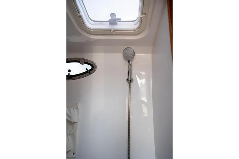 Slide: The Image of Shower area in 2025 Southport 38 FE boat with skylight and porthole. - 33