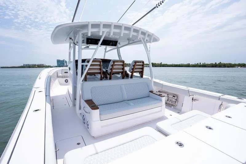 Slide: The Image of 2025 Southport 38 FE boat interior with seating, on calm water. - 6