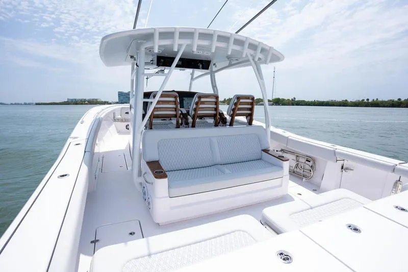 Slide: The Image of 2025 Southport 38 FE boat interior with seating, ocean view, and clear sky. - 7