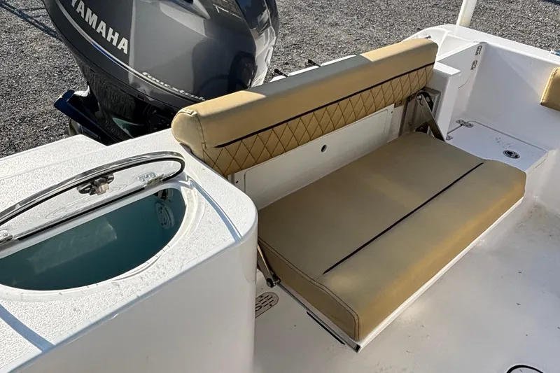 Slide: The Image of 2023 Sportsman Open 212 Center Console boat with Yamaha engine and tan seating. - 3