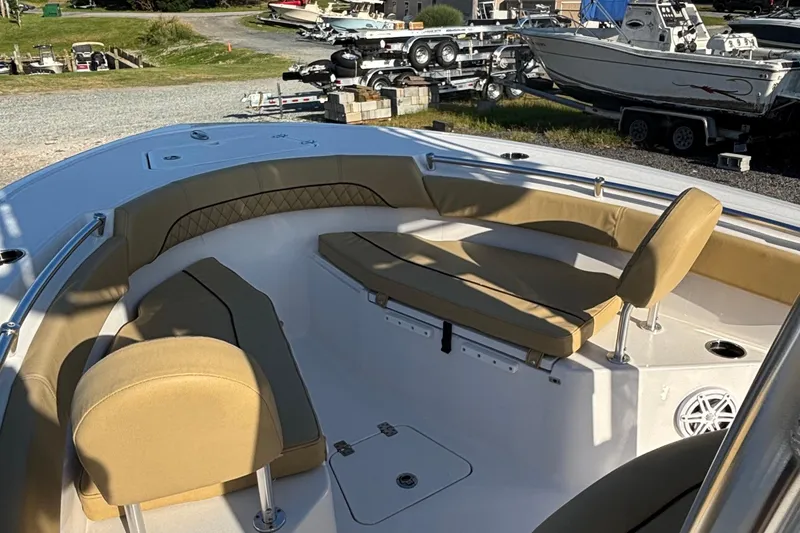 Slide: The Image of 2023 Sportsman Open 212 Center Console boat with tan seating and spacious deck. - 4