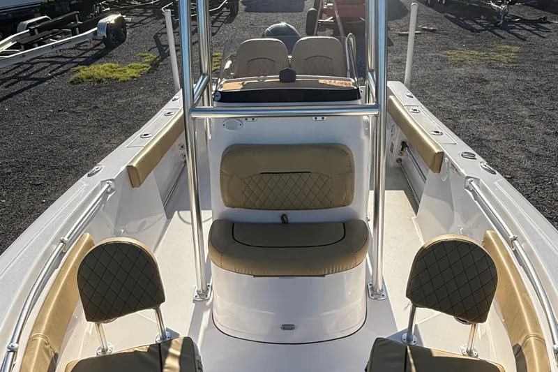 Slide: The Image of 2023 Sportsman Open 212 Center Console boat with tan seating and sleek design. - 5