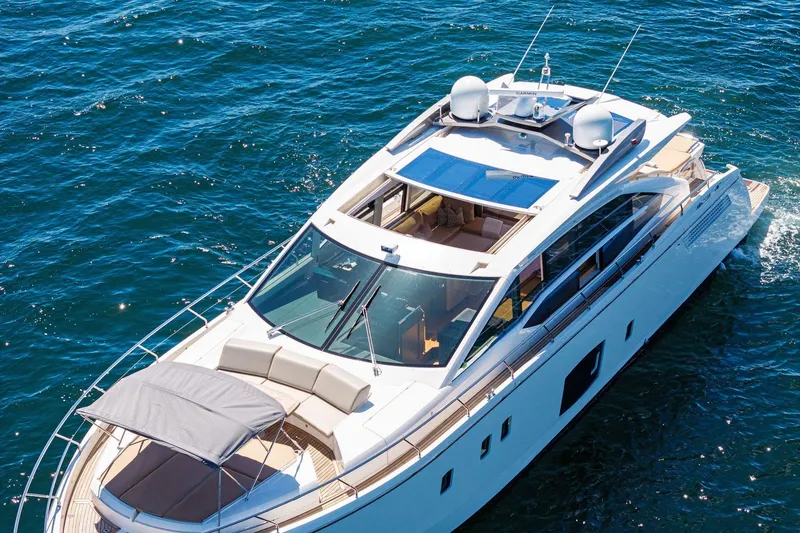 Slide: The Image of Luxurious 2013 Absolute 64 yacht cruising on clear blue waters. - 10