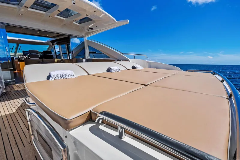 Slide: The Image of Luxurious 2013 Absolute 64 yacht with sunbathing deck, ocean view, and clear blue sky. - 17