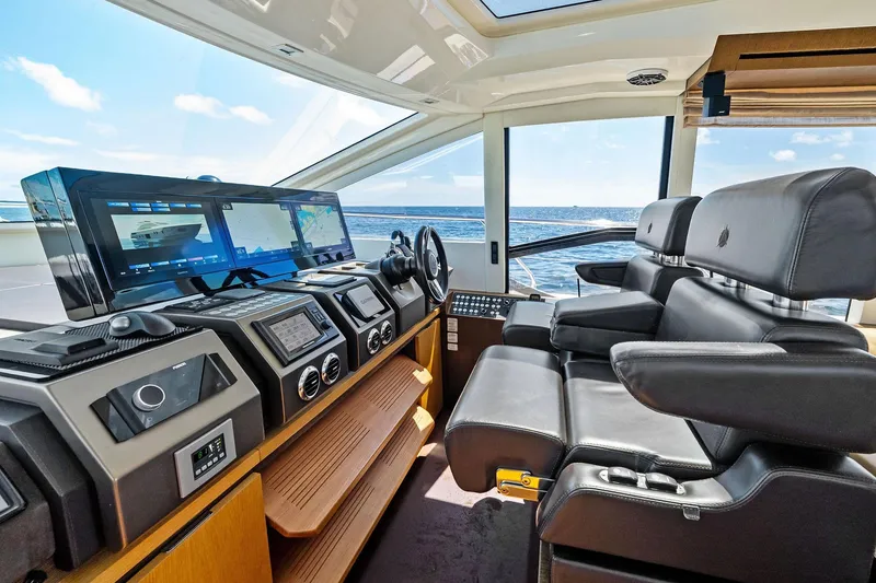 Slide: The Image of Luxurious 2013 Absolute 64 yacht cockpit with advanced navigation systems and leather seating. - 22