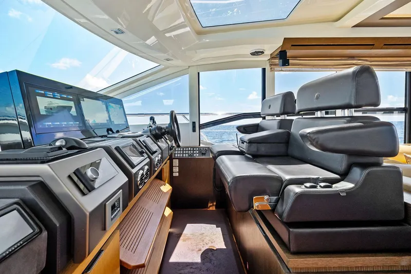 Slide: The Image of Luxurious interior of a 2013 Absolute 64 yacht with modern navigation equipment and leather seating. - 23