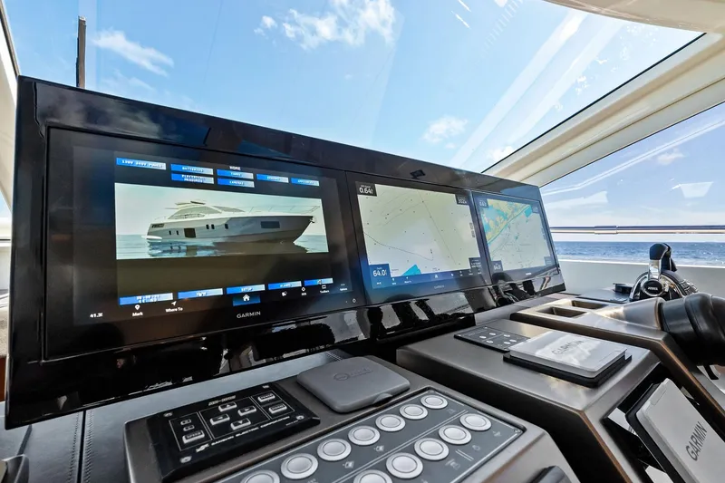 Slide: The Image of Control panel of 2013 Absolute 64 yacht with navigation screens and ocean view. - 24