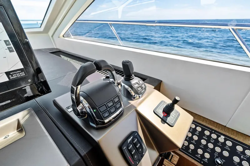 Slide: The Image of Control panel of a 2013 Absolute 64 yacht with ocean view. - 25