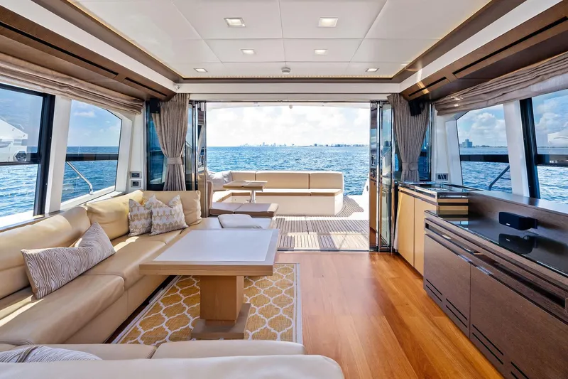 Slide: The Image of Luxurious interior of 2013 Absolute 64 yacht with ocean view, featuring elegant seating and modern decor. - 29