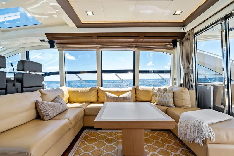Slide: The Image of Luxurious interior of 2013 Absolute 64 yacht with ocean view, beige seating, and modern decor. - 30