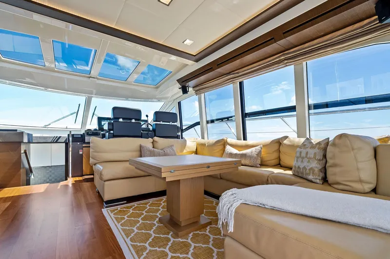 Slide: The Image of Luxurious interior of 2013 Absolute 64 yacht with plush seating and panoramic windows. - 31