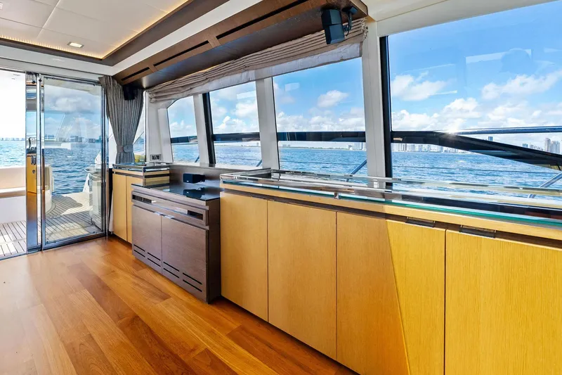 Slide: The Image of Luxurious interior of a 2013 Absolute 64 yacht with ocean view through large windows. - 33