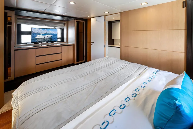 Slide: The Image of Luxurious bedroom interior on a 2013 Absolute 64 yacht, featuring modern design and elegant decor. - 47
